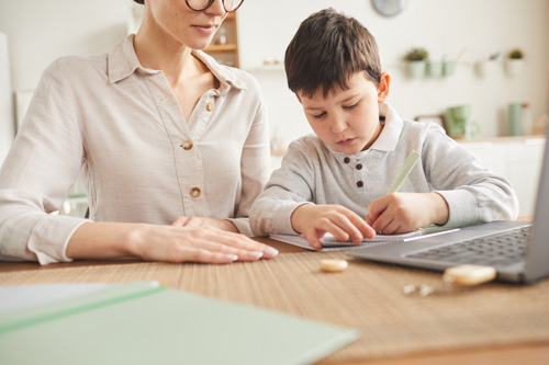boy-studying-at-home-with-mom-2021-04-04-13-02-33-utc
