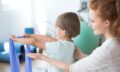 physiotherapist-supporting-kid.jpg